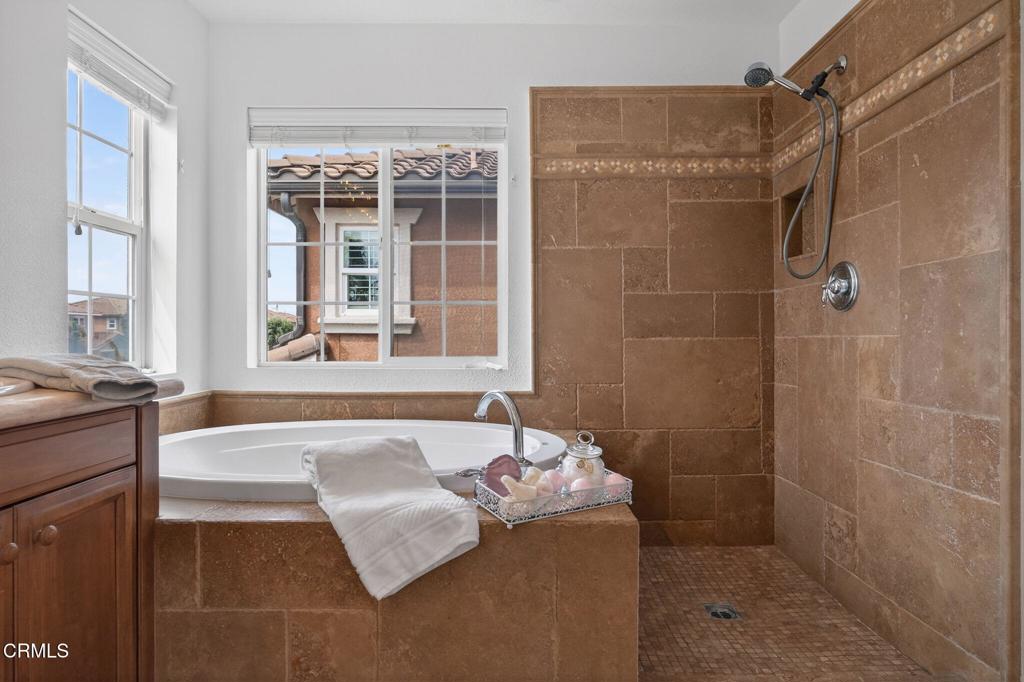 740 Freeport Lane Oxnard, CA 93035 - Photo 27 of 35 a spacious bathroom with a granite countertop tub a sink and a shower