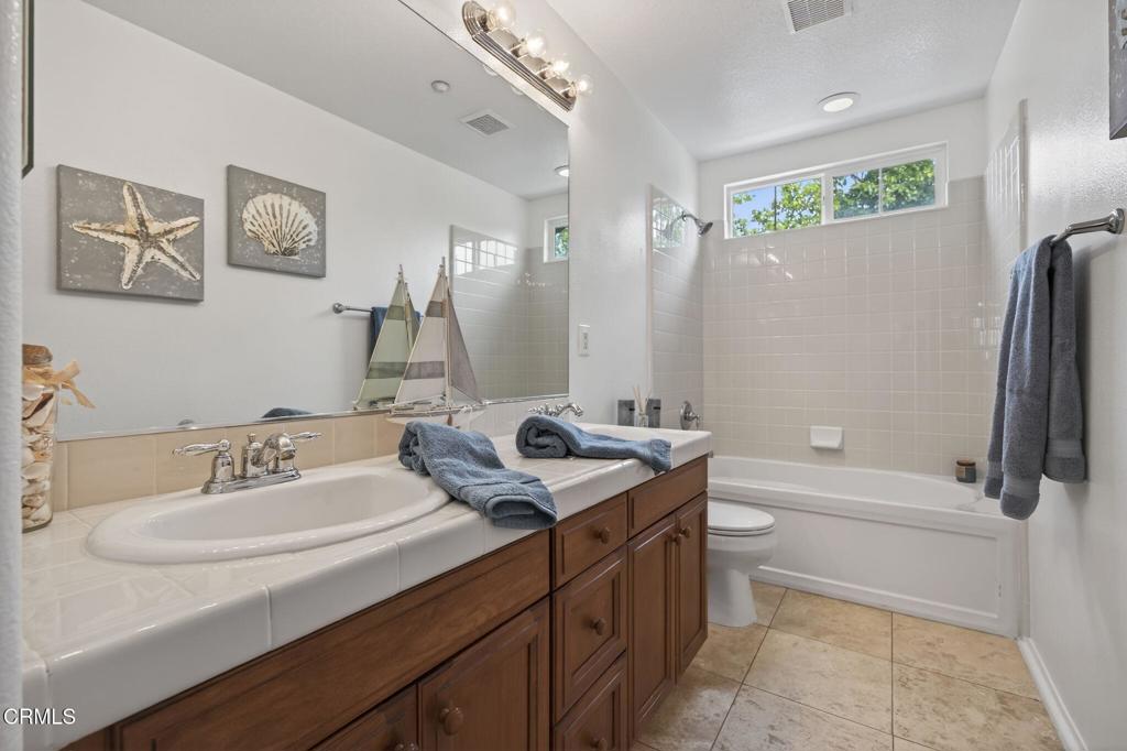 740 Freeport Lane Oxnard, CA 93035 - Photo 29 of 35 a bathroom with a sink a toilet and a mirror