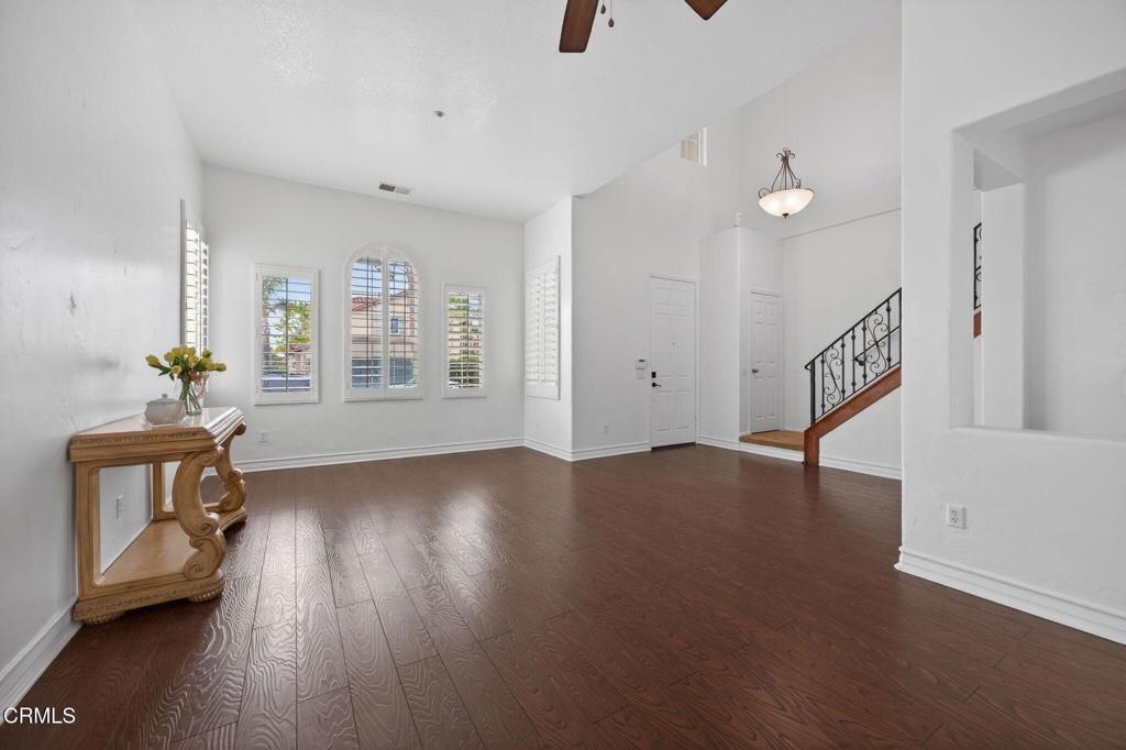 740 Freeport Lane Oxnard, CA 93035 - Photo 5 of 35 a view of an empty room with a window and wooden floor