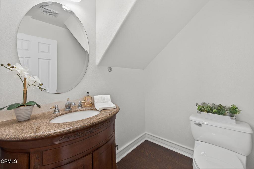 740 Freeport Lane Oxnard, CA 93035 - Photo 7 of 35 a bathroom with a granite countertop sink and a mirror