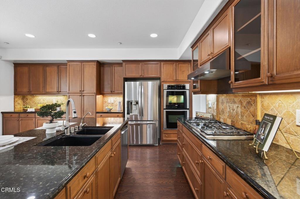 740 Freeport Lane Oxnard, CA 93035 - Photo 9 of 35 a kitchen with stainless steel appliances granite countertop a sink stove and refrigerator