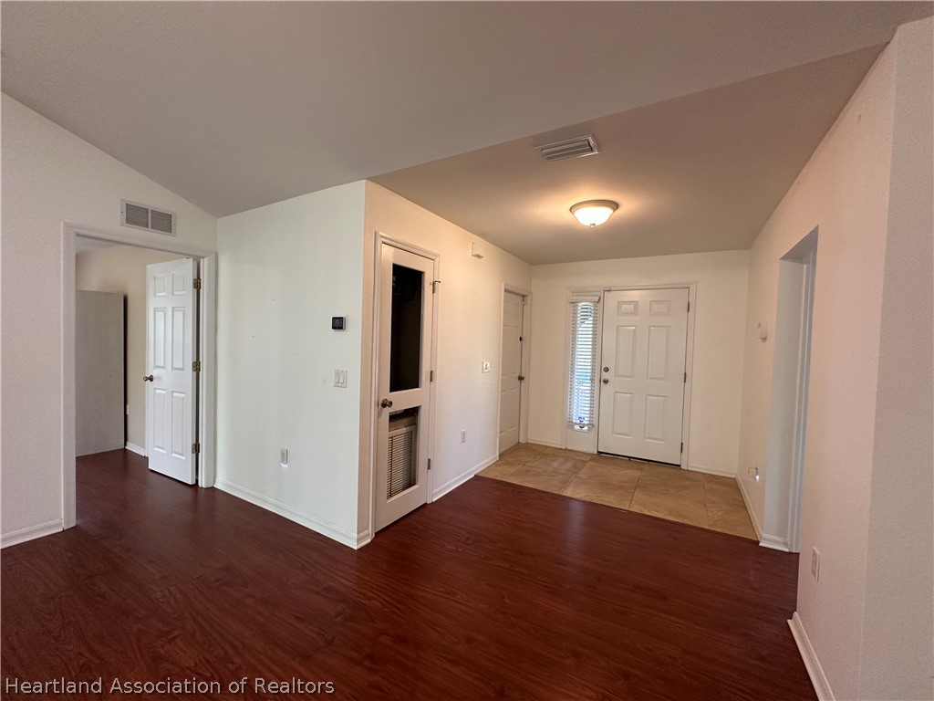 8737 Capilla Street Sebring, FL 33872 - Photo 14 of 43 a view of a livingroom with wooden floor