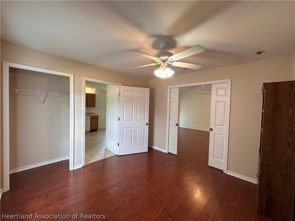 8737 Capilla Street Sebring, FL 33872 - Photo 20 of 43 a view of an empty room with wooden floor