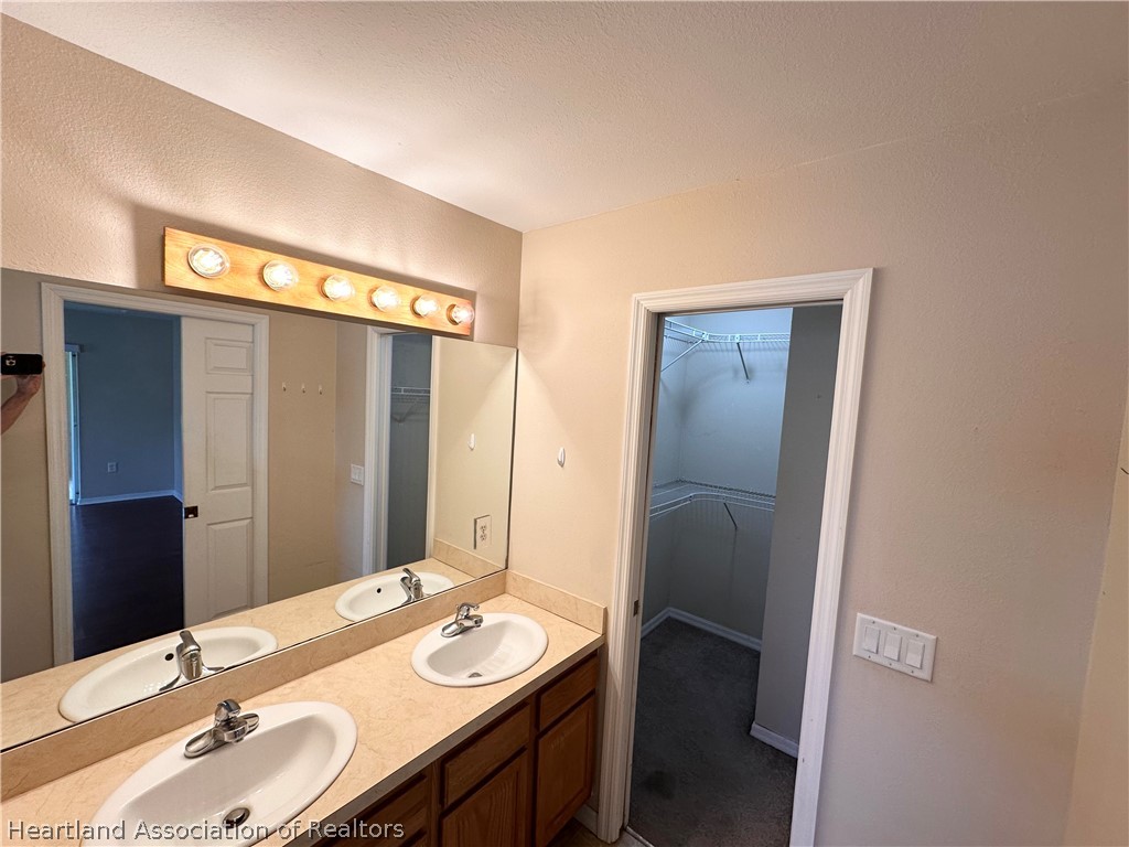 8737 Capilla Street Sebring, FL 33872 - Photo 27 of 43 a bathroom with a sink and a mirror