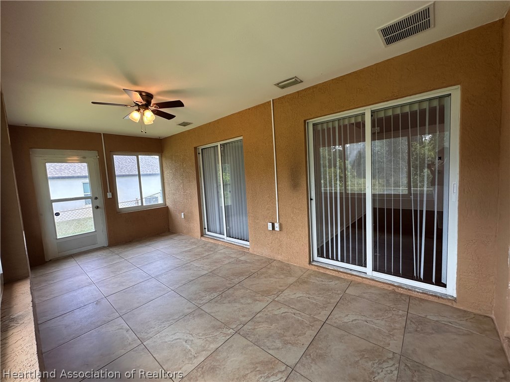 8737 Capilla Street Sebring, FL 33872 - Photo 33 of 43 a view of an empty room with a window