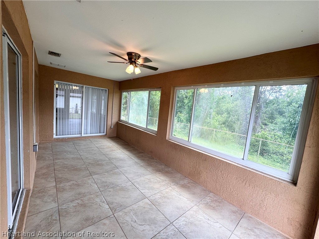 8737 Capilla Street Sebring, FL 33872 - Photo 35 of 43 a view of an empty room with a window