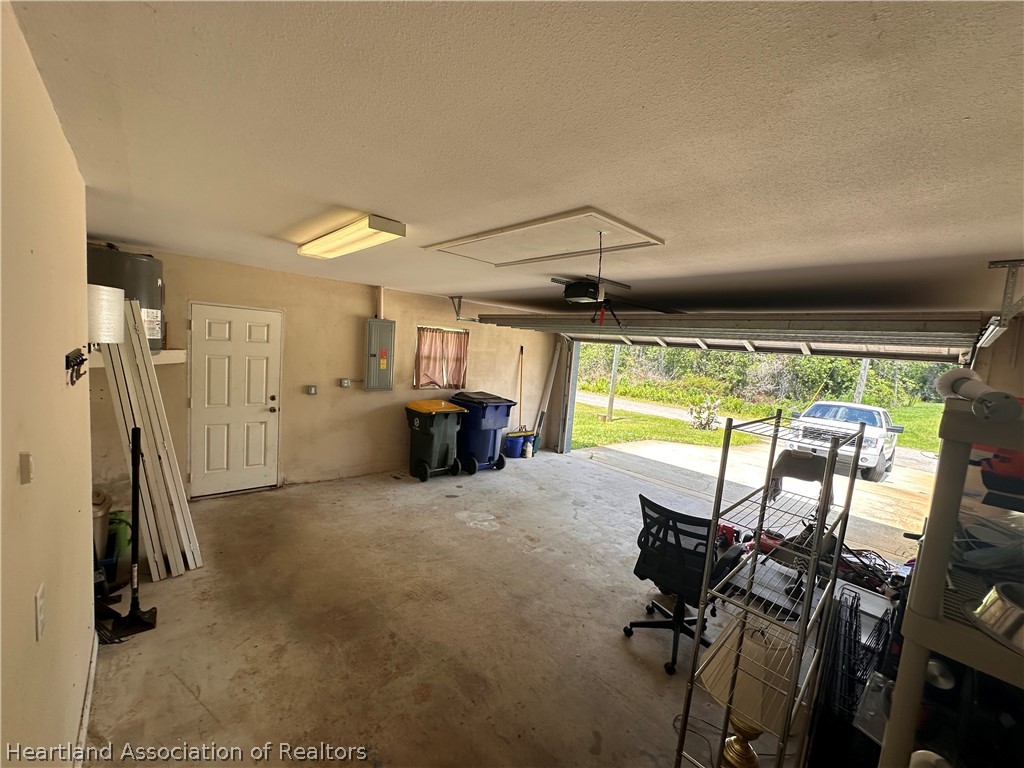 8737 Capilla Street Sebring, FL 33872 - Photo 36 of 43 a view of a room with gym equipment