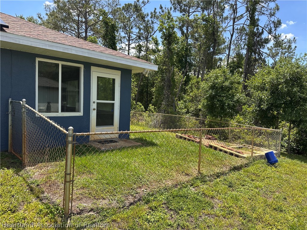 8737 Capilla Street Sebring, FL 33872 - Photo 4 of 43 a view of a house with a backyard