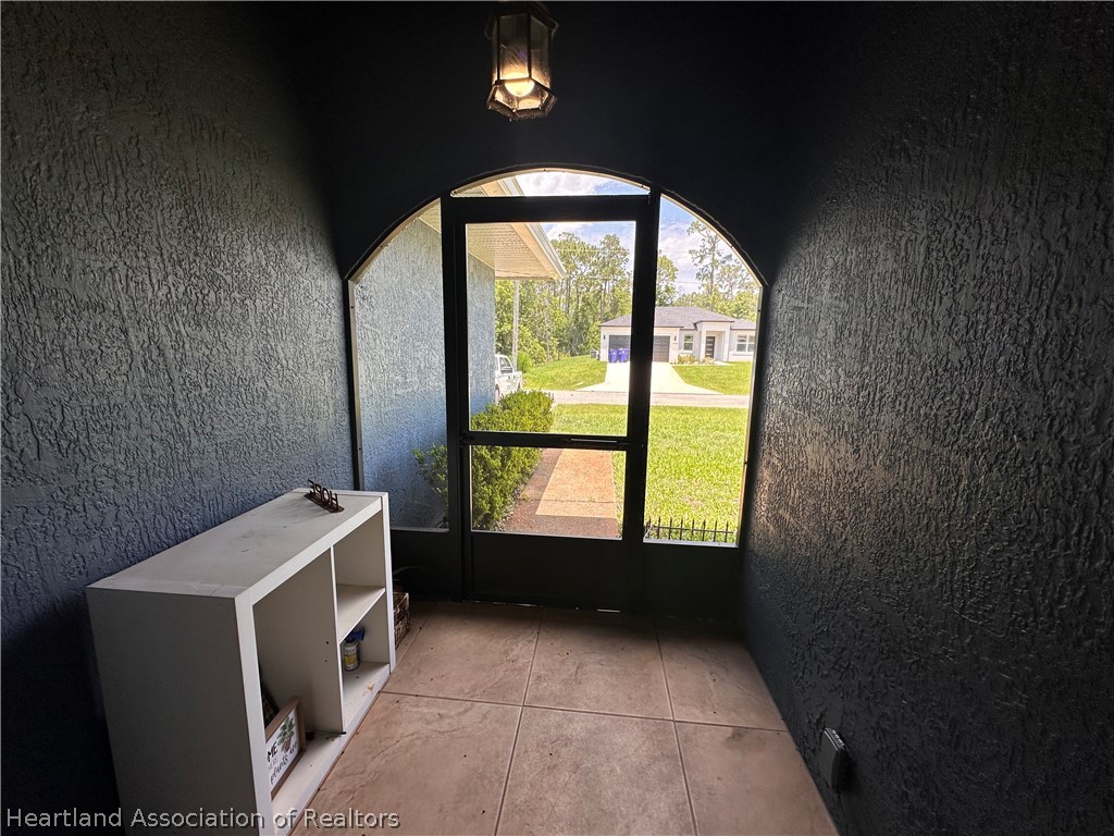 8737 Capilla Street Sebring, FL 33872 - Photo 41 of 43 a room with a washer and dryer
