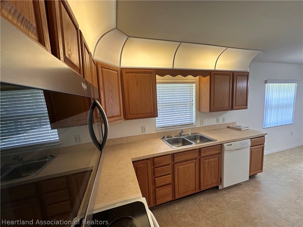8737 Capilla Street Sebring, FL 33872 - Photo 7 of 43 a bathroom with a sink and a mirror
