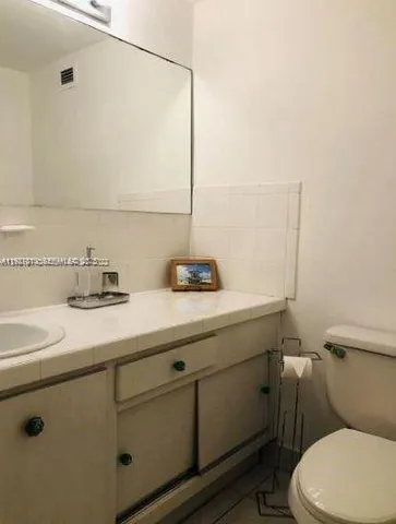 a bathroom with a sink and a toilet