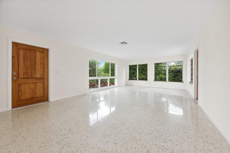 490 Northeast 5th Circle Boca Raton, FL 33431 - Photo 3 of 17 03_490NE5thCir_148_FoyerLivingRoom_FlexM
