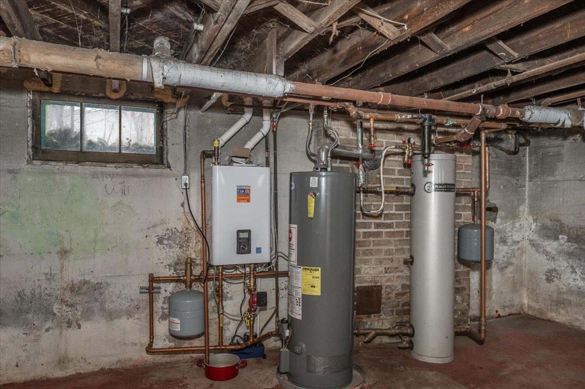 701 East 4th Street Superior, WI 54880 - Photo 13 of 16 Utility room with water heater and tankless water heater