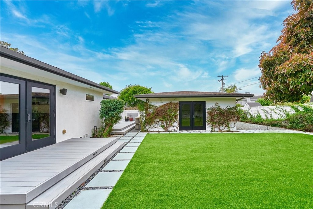 345 Broadway Costa Mesa, CA 92627 - Photo 17 of 20 a front view of a house with a yard table and chairs