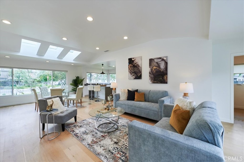 345 Broadway Costa Mesa, CA 92627 - Photo 4 of 20 a living room with furniture and a large window