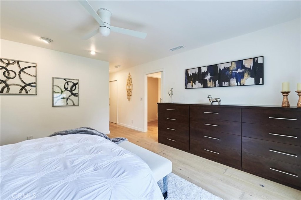 345 Broadway Costa Mesa, CA 92627 - Photo 10 of 20 a bedroom with a bed and a dresser