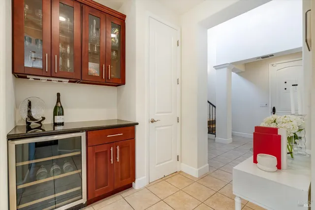 a view of a porch with wooden floor and iron fence