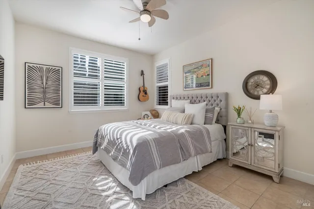 a view of a patio with table and chairs with wooden floor and fence