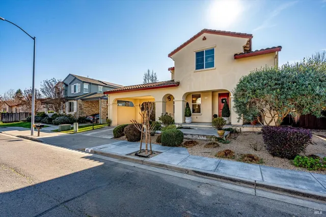 a view of house with swimming pool outdoor seating