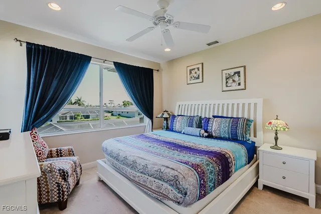 a bedroom with bed and window