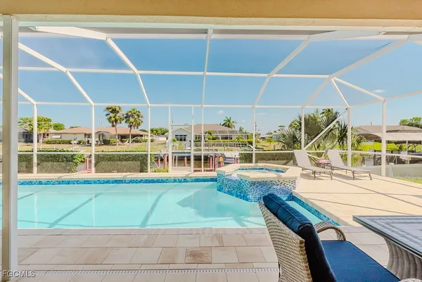 a view of a swimming pool with an outdoor seating