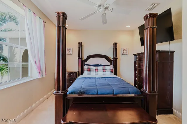 a living room with a bed furniture and a window