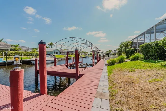 a view of a patio with a table and chairs