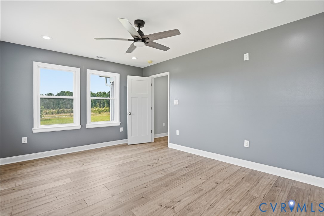 7839 King William Road Aylett, VA 23009 - Photo 17 of 38 a view of room with window ceiling fan and hardwood floor