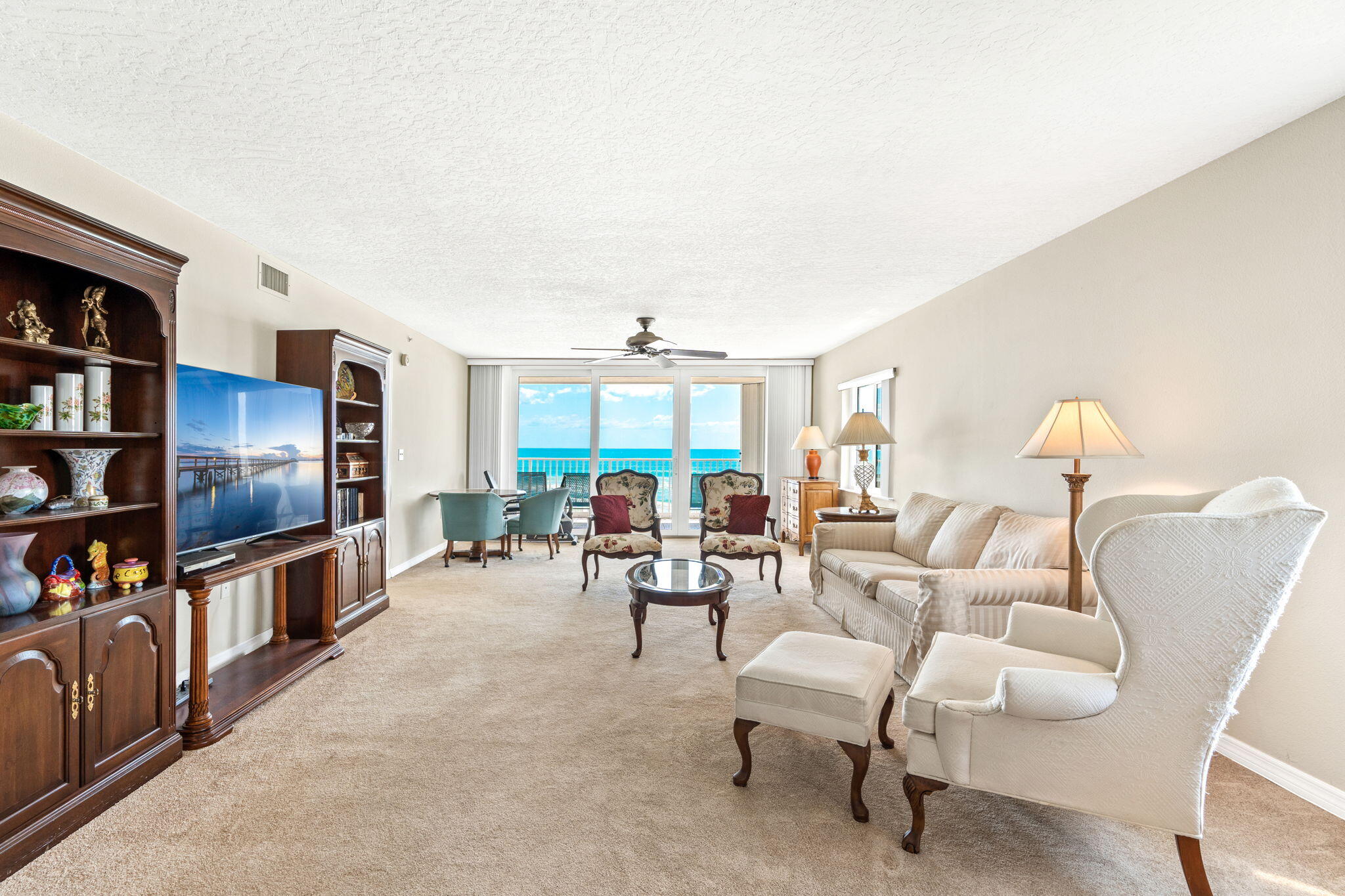 1505 North Hwy A1A, Unit 304 Indialantic, FL 32903 - Photo 4 of 27 a living room with furniture and a flat screen tv