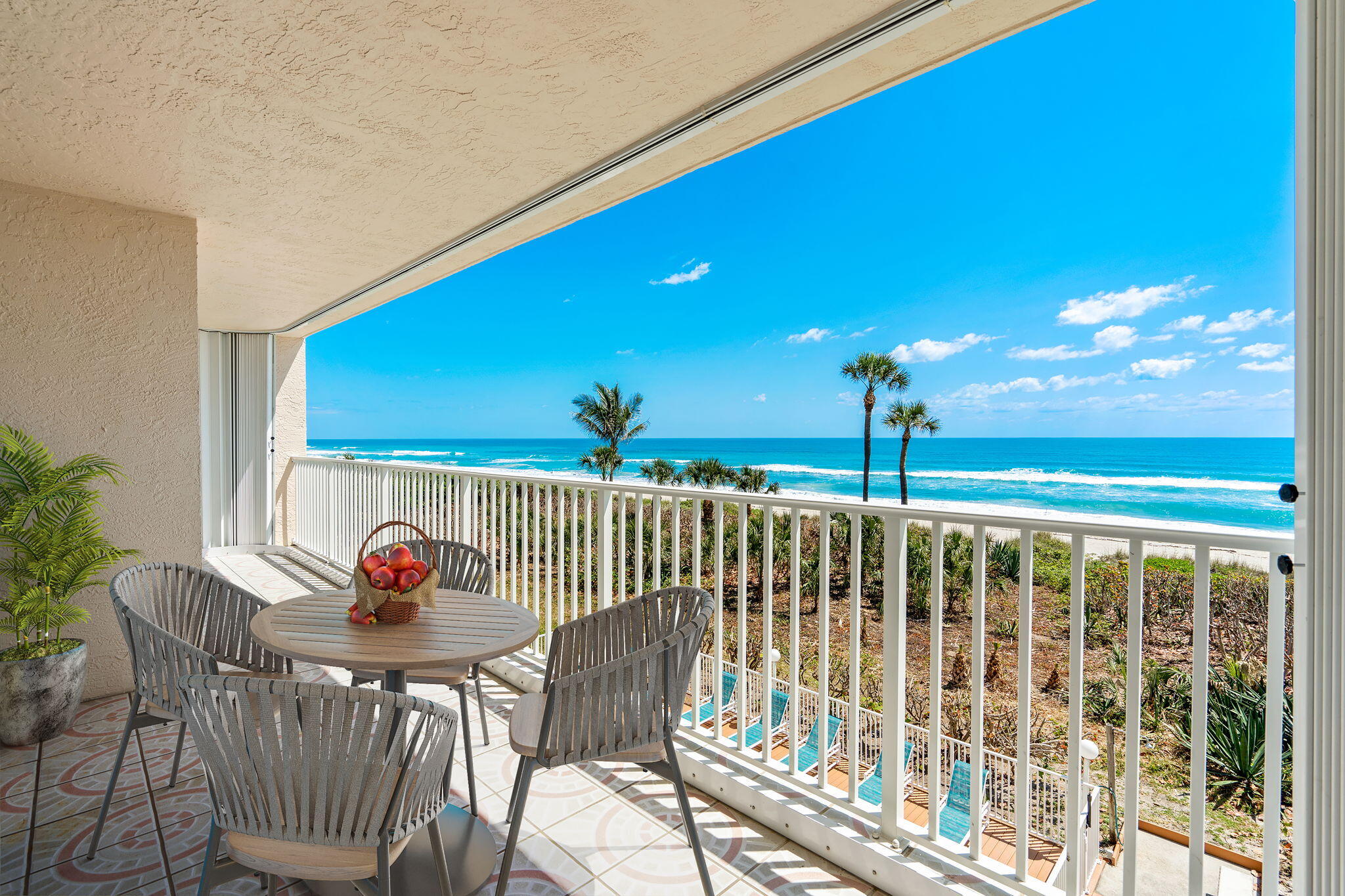 1505 North Hwy A1A, Unit 304 Indialantic, FL 32903 - Photo 6 of 27 a view of a chairs and table in patio with a fire pit