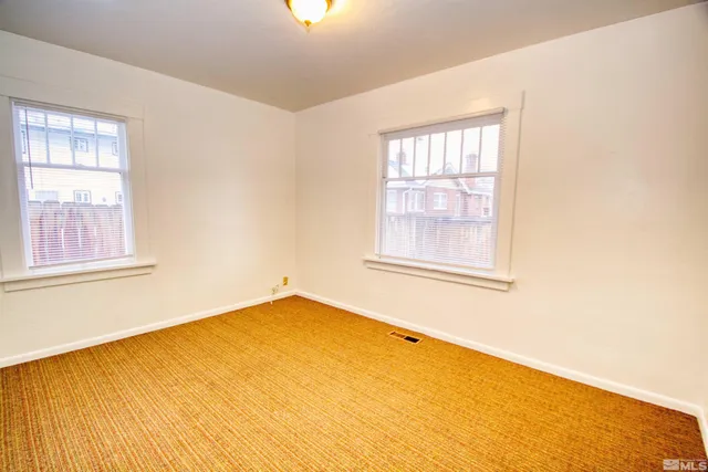 a view of a room with windows