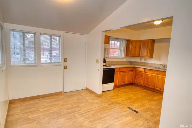 a kitchen with a stove a sink and a refrigerator