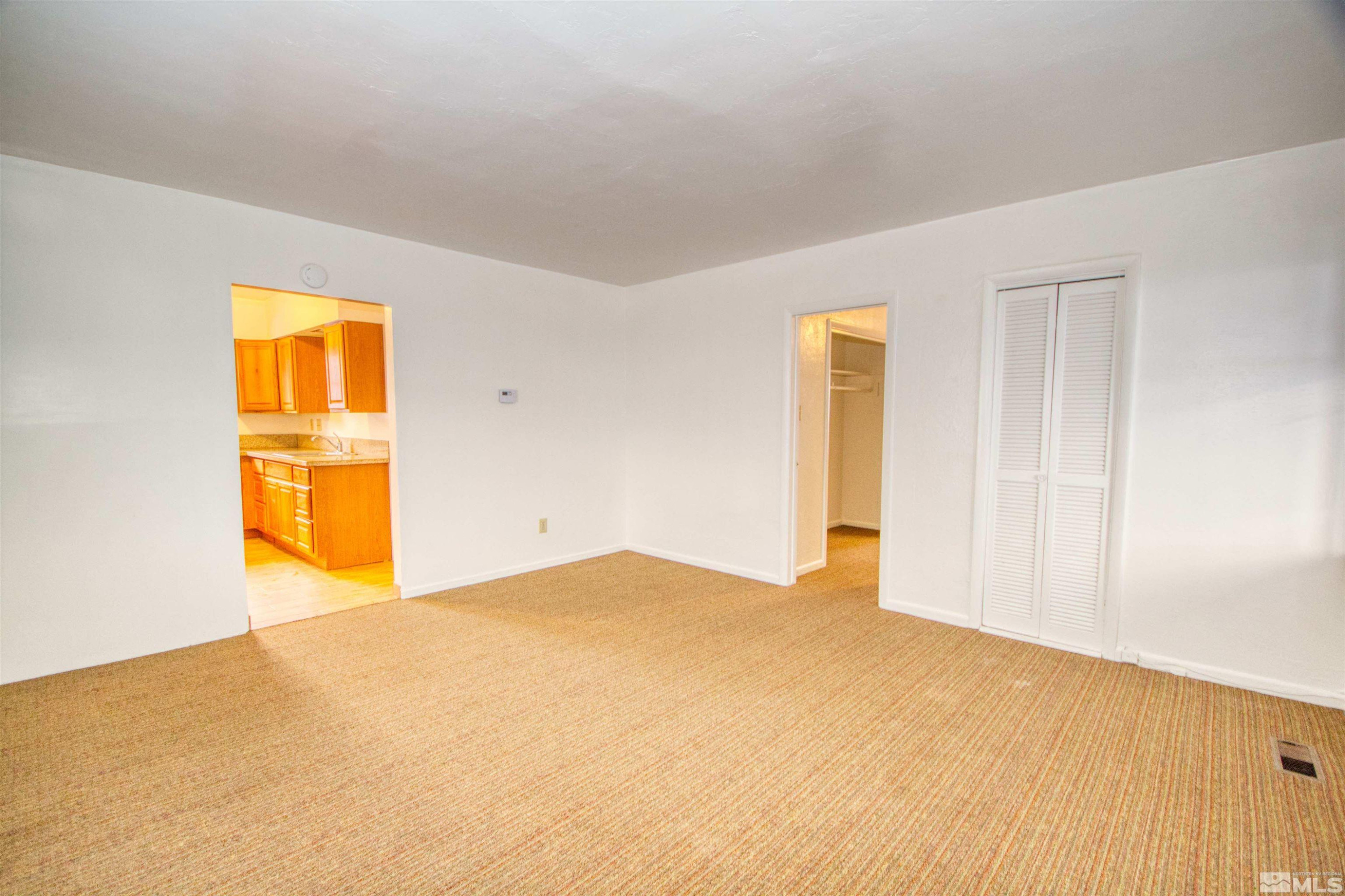 829 Plumas Street, Unit C Reno, NV 89509 - Photo 7 of 12 a view of a big room with wooden floor and a bathroom