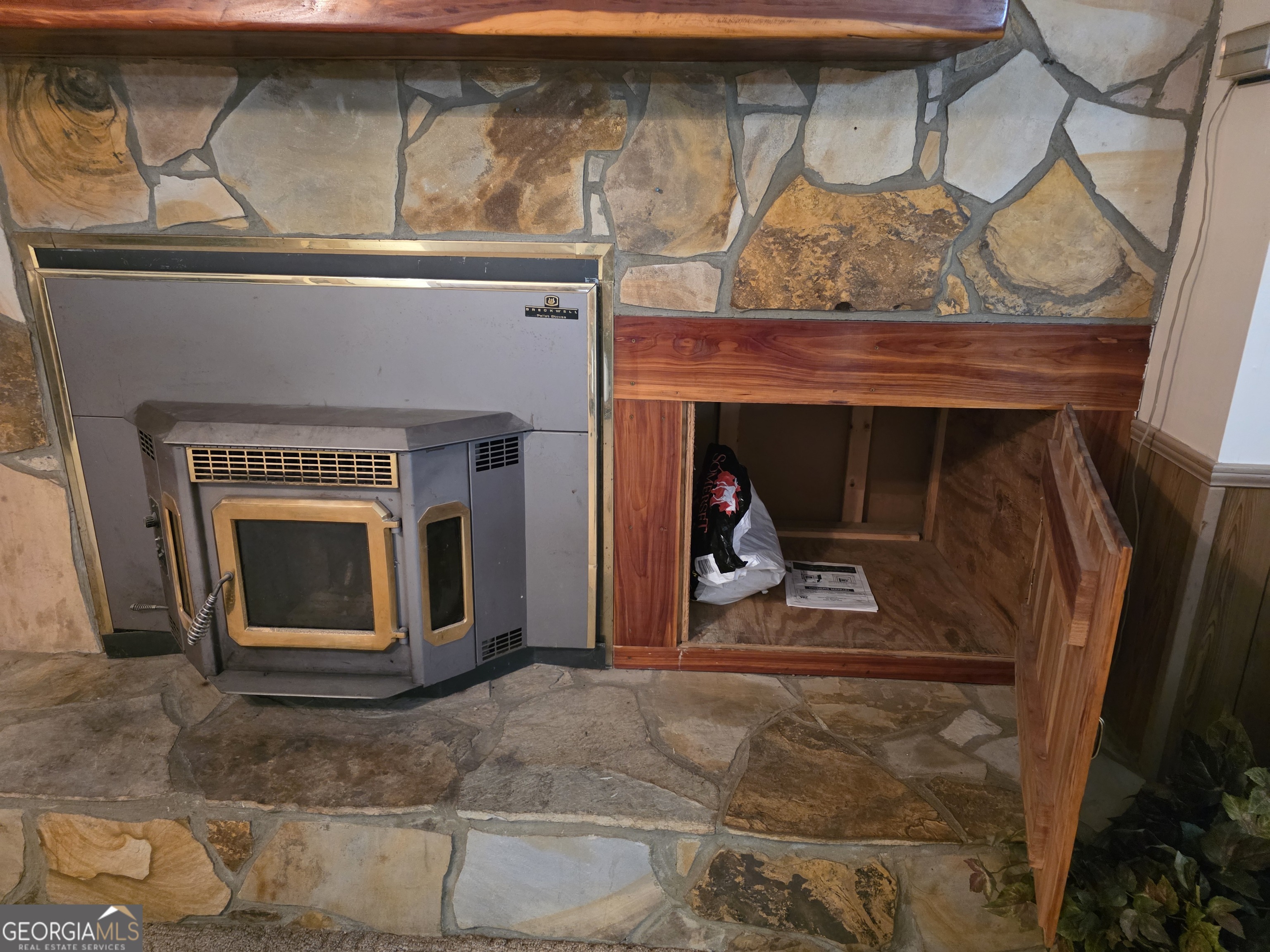 3879 Caney Head Road Roopville, GA 30217 - Photo 16 of 64 a living room with a fireplace