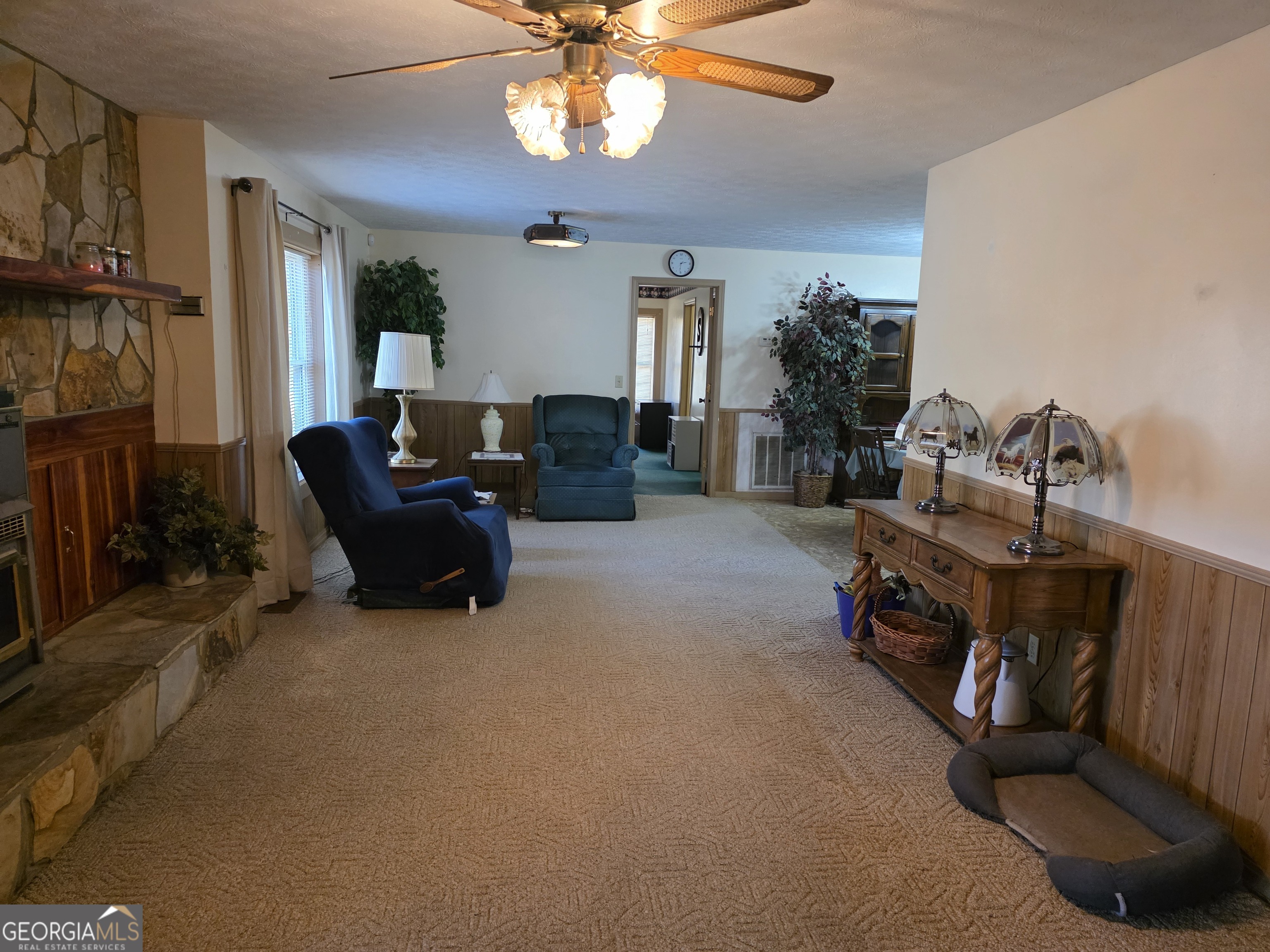 3879 Caney Head Road Roopville, GA 30217 - Photo 17 of 64 a living room with furniture gym equipment and a flat screen tv