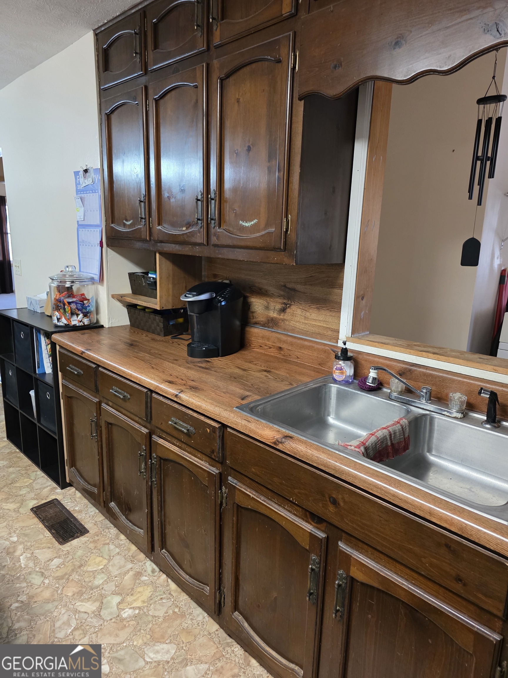 3879 Caney Head Road Roopville, GA 30217 - Photo 21 of 64 a view of a refrigerator a sink and dishwasher with wooden floor
