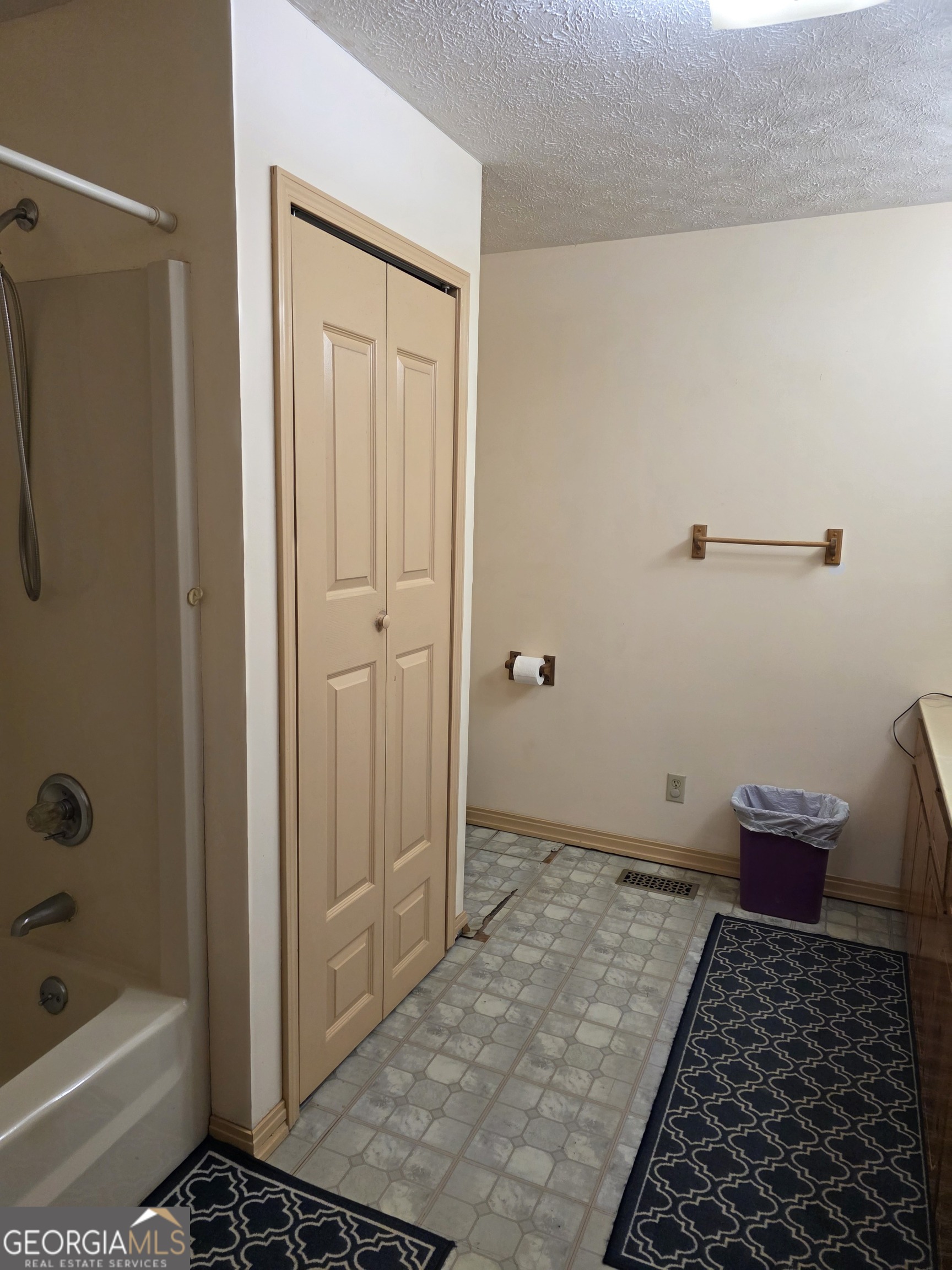 3879 Caney Head Road Roopville, GA 30217 - Photo 25 of 64 a bathroom with a bathtub and shower