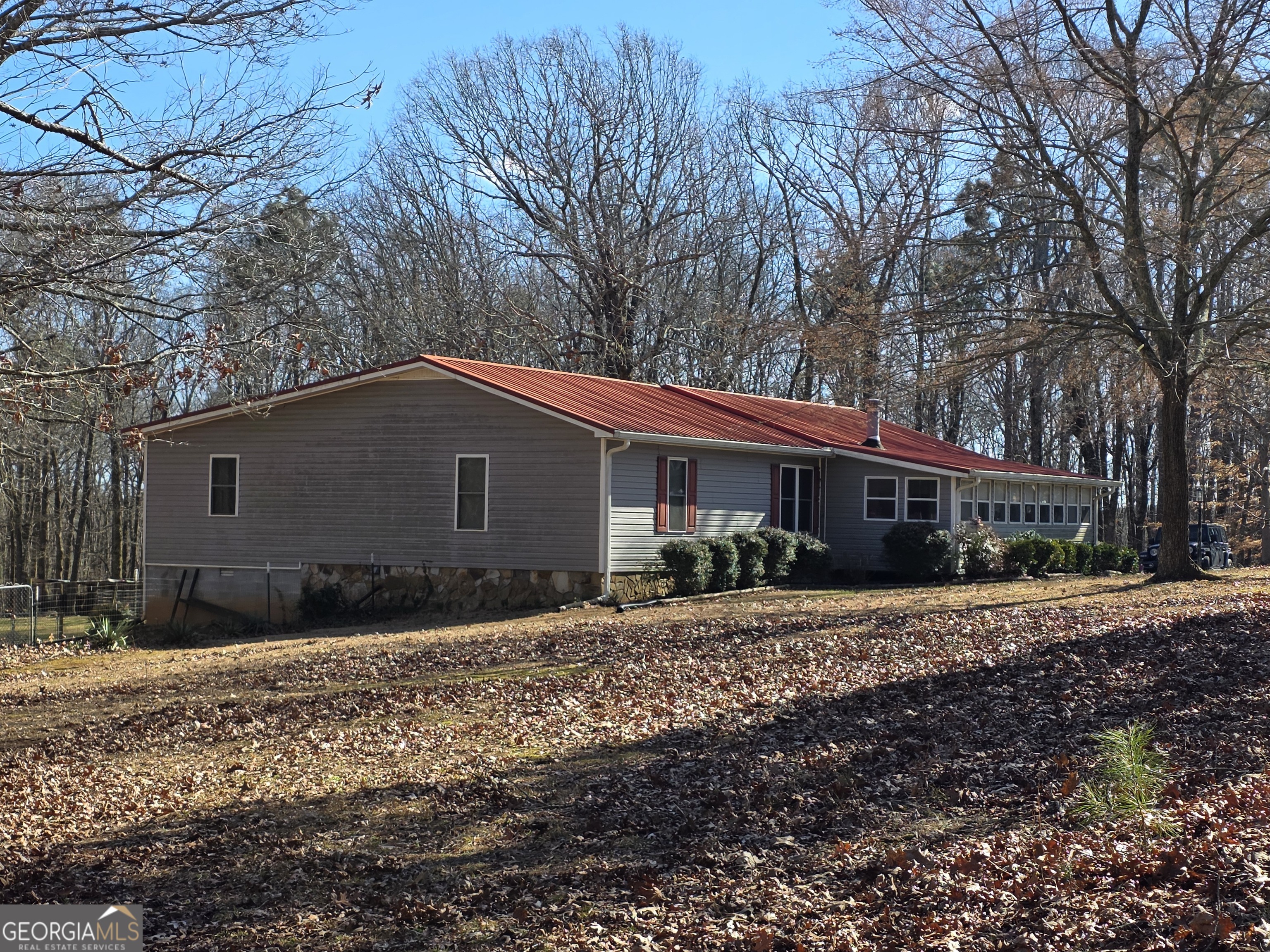 3879 Caney Head Road Roopville, GA 30217 - Photo 4 of 64 a house with trees in front of it
