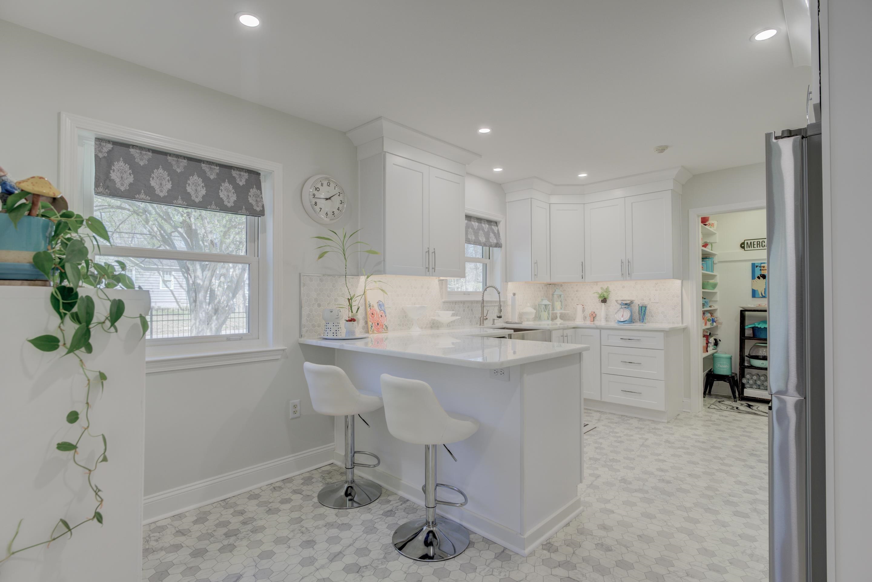 140 North Perkins Road Memphis, TN 38117 - Photo 8 of 25 a kitchen with kitchen island a sink a stove a refrigerator cabinets and dining table