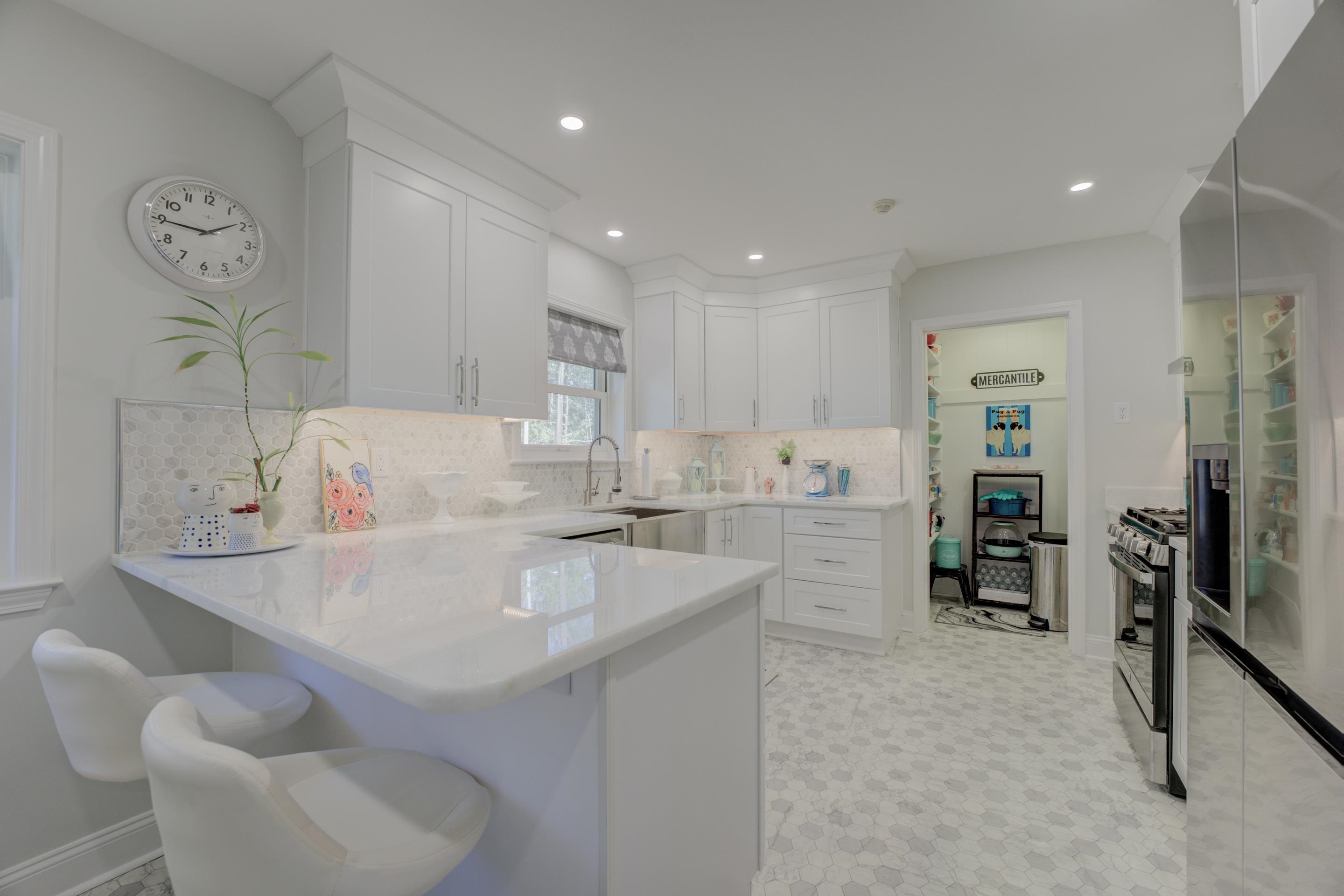 140 North Perkins Road Memphis, TN 38117 - Photo 9 of 25 a large white kitchen with a sink and breakfast area
