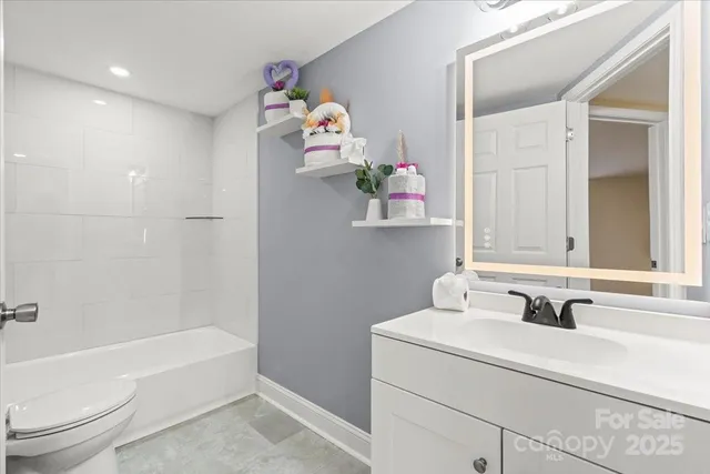 a bathroom with a sink a toilet and a bathtub