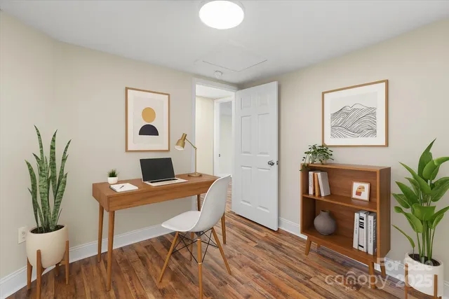 a workspace with furniture and wooden floor