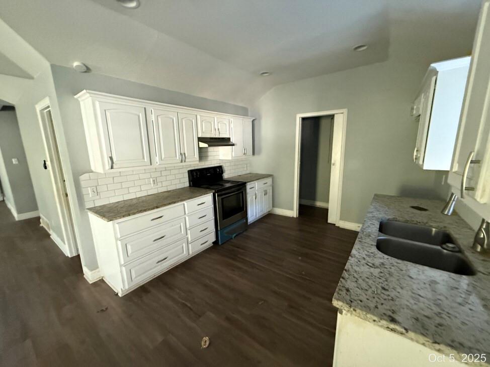 2009 Apache Road Quinlan, TX 75474 - Photo 12 of 19 a kitchen with granite countertop white cabinets and white appliances