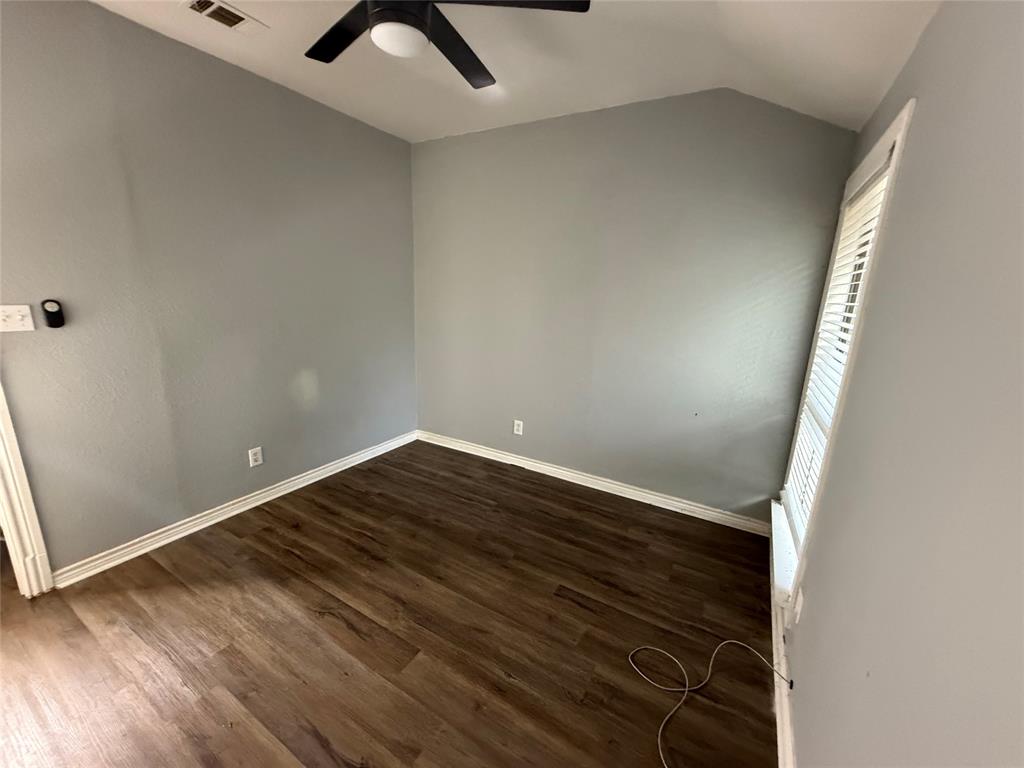 2009 Apache Road Quinlan, TX 75474 - Photo 14 of 19 an empty room with wooden floor and windows