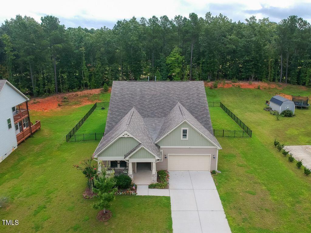 a aerial view of a house with a yard