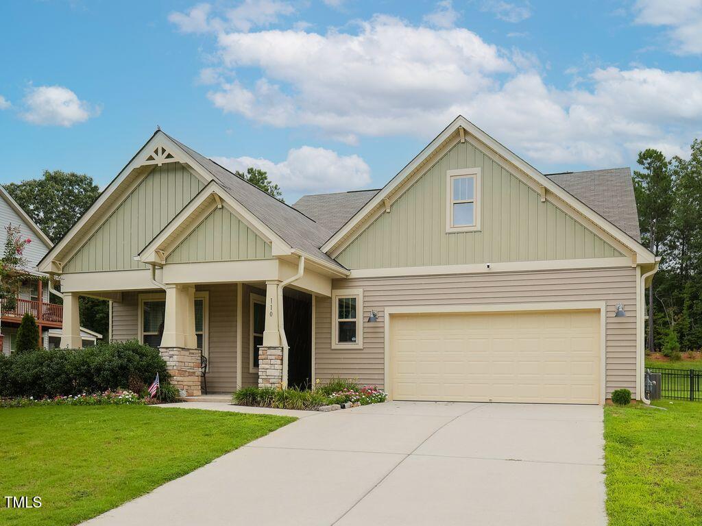 110 Point View Way Franklinton, NC 27525 - Photo 2 of 62 a front view of a house with a yard and garage