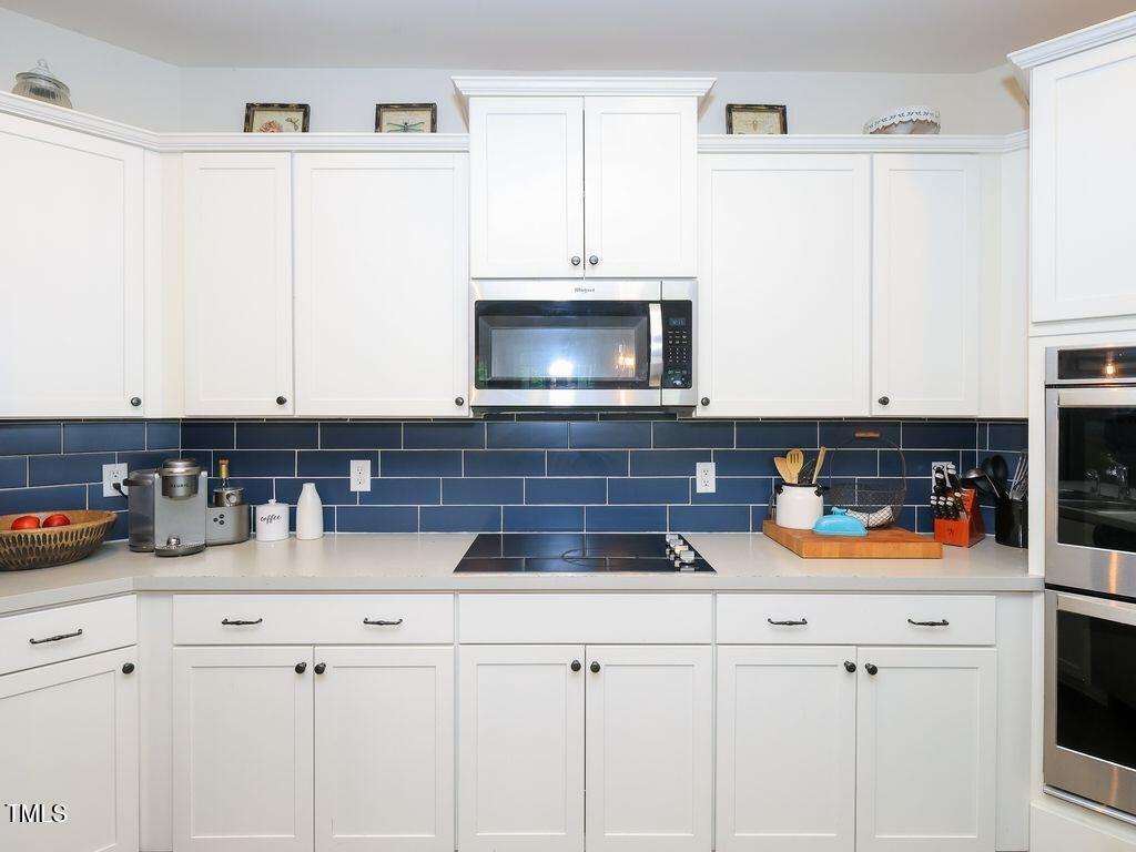 110 Point View Way Franklinton, NC 27525 - Photo 21 of 62 a kitchen with appliances a sink and cabinets