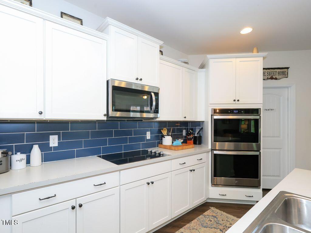 110 Point View Way Franklinton, NC 27525 - Photo 22 of 62 a kitchen with stainless steel appliances and cabinets