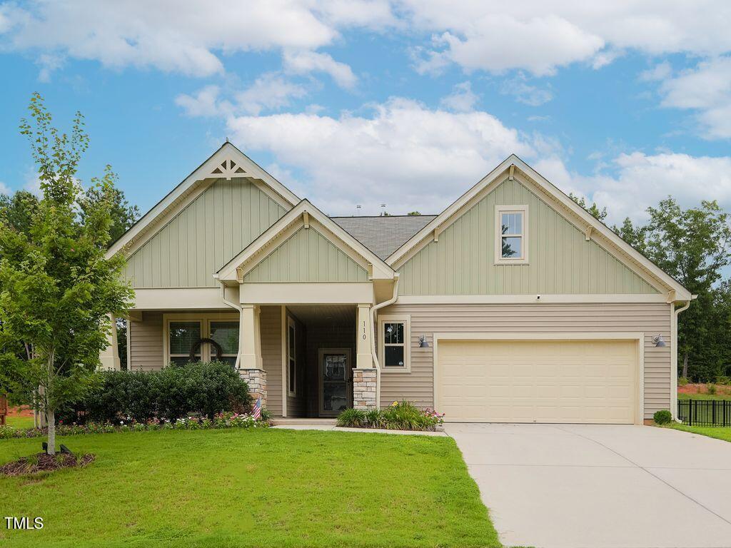 110 Point View Way Franklinton, NC 27525 - Photo 3 of 62 a front view of a house with a yard and garage
