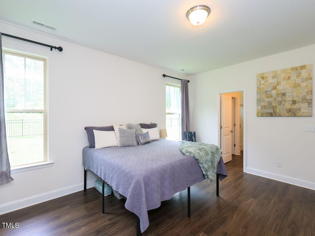 110 Point View Way Franklinton, NC 27525 - Photo 33 of 62 a bedroom with a bed and wooden floor